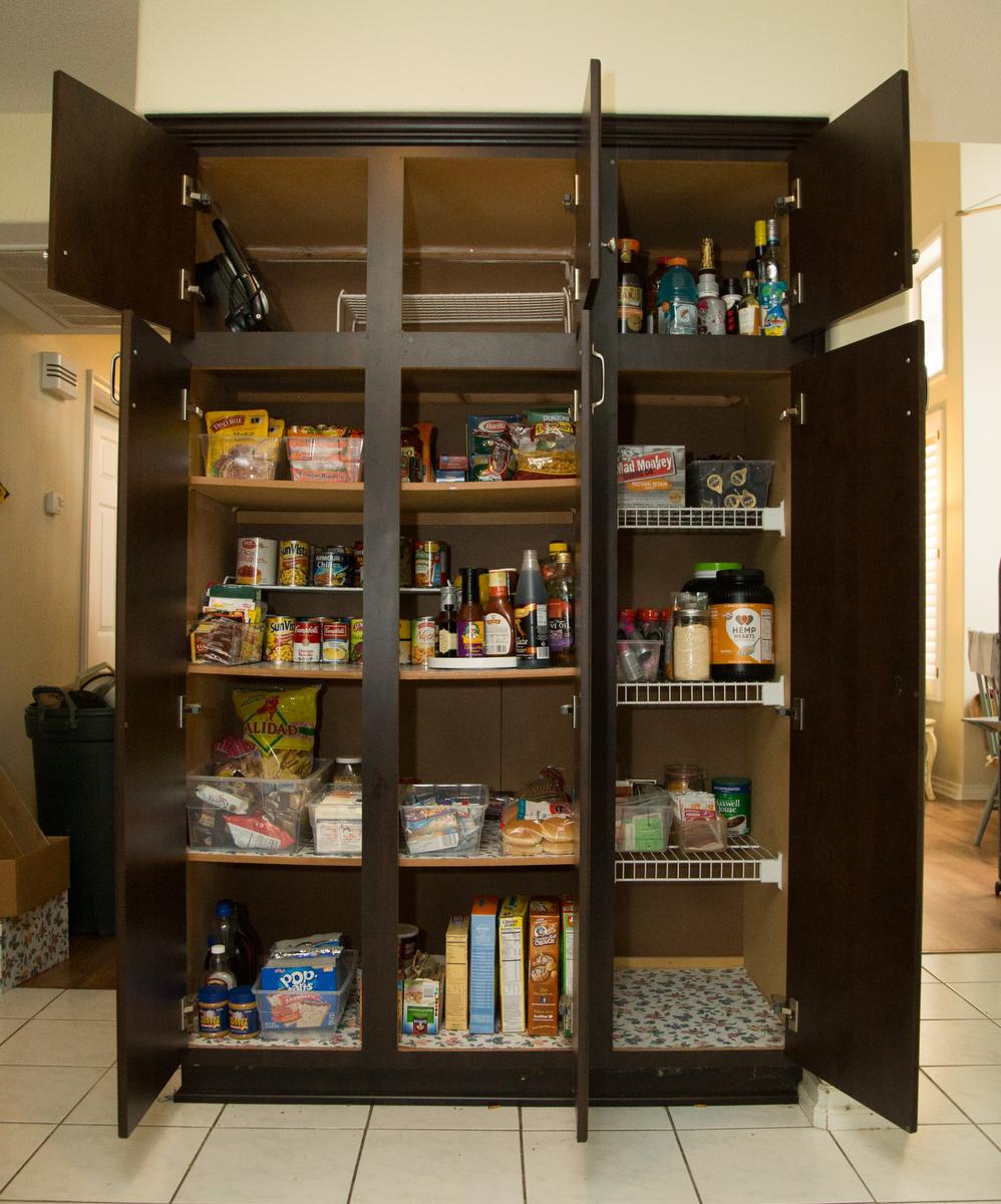 A view of a kitchen pantry after being decluttered by professional organizer Kirsten Ranger of Organized & Orderly at a private residence in Trabuco Canyon on Tuesday. ////ADDITIONAL INFORMATION: lansner.declutter - 7/7/15 - JOSH BARBER, - ORANGE COUNTY REGISTER - at on Tuesday, July 7, 2015 in Trabuco Canyon, Calif. Columnist Jon Lansner will have a room in his home "decluttered" by decluttering expert Kirsten Ranger of Organized & Orderly of Organized & Orderly