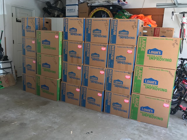 stacked boxes in garage for move